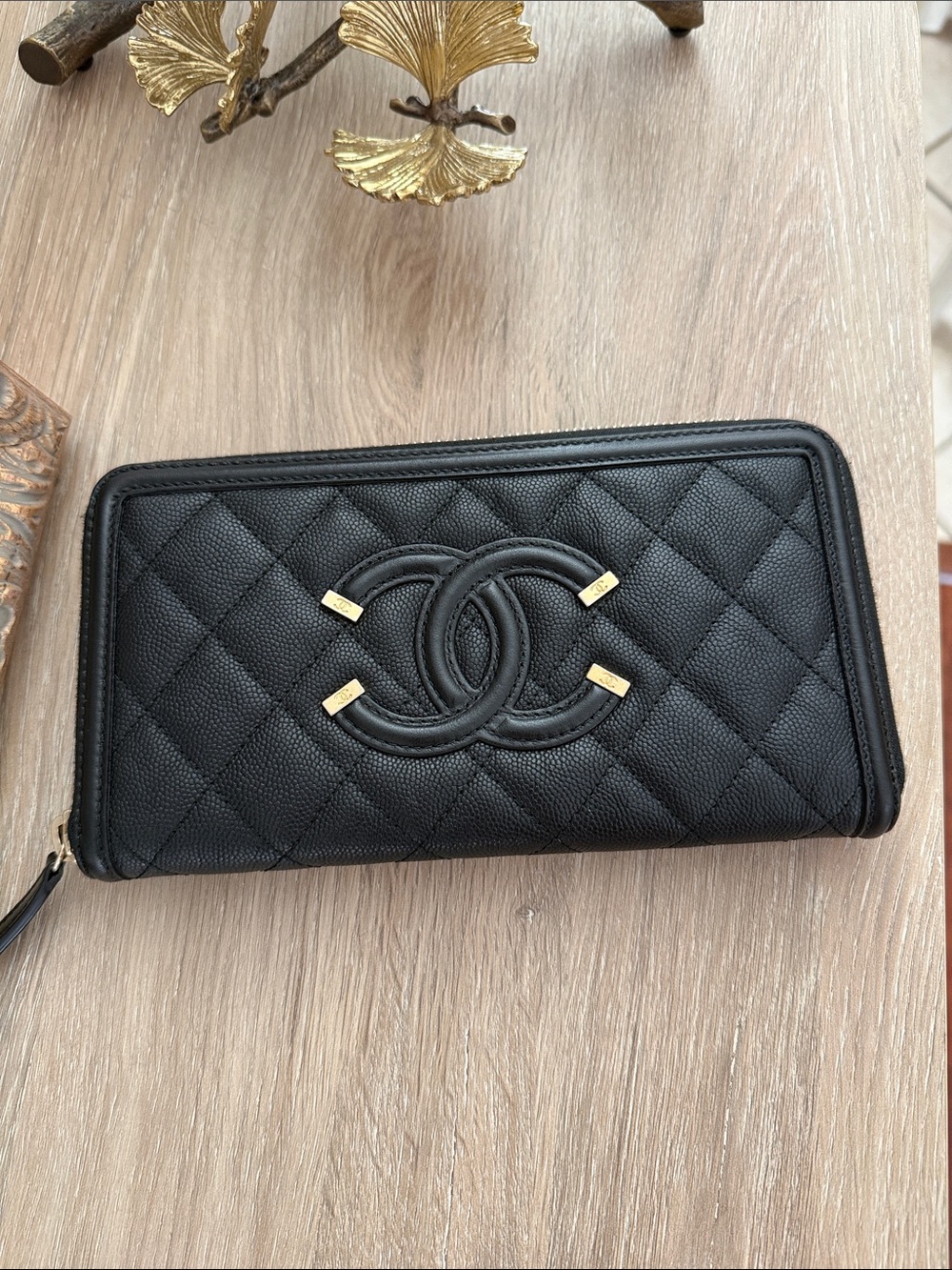 CHANEL Black Quilted Zip-Around Wallet with Gold Accents